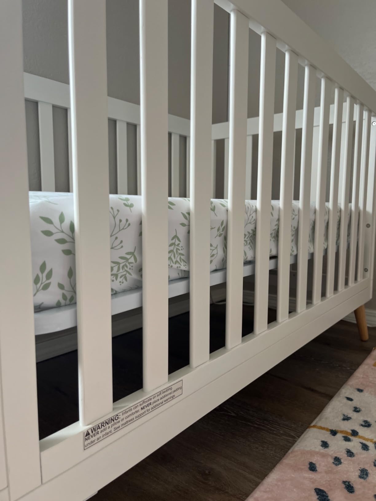 Delta Children Essex 4-in-1 Convertible Baby Crib, Bianca White with Natural Legs, GREENGUARD Gold Certified customer photo 1