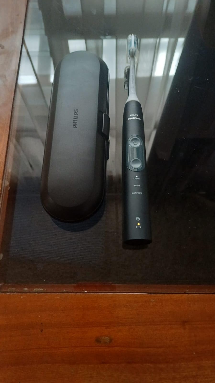 Philips Sonicare ProtectiveClean 5300 Rechargeable Electric Toothbrush, with Pressure Sensor, 3 Cleaning Modes, SmarTimer and QuadPacer, with 2 Bonus Brush Heads, Travel Case, Black, Model HX6423/34 customer photo 1
