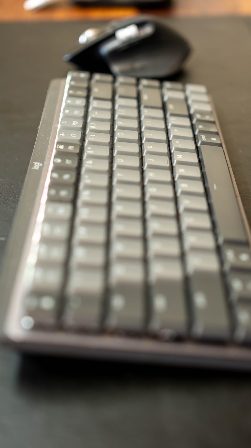 Logitech MX Mechanical Mini Mac Wireless Keyboard Low-Profile - Pale Grey | Low-profile full-size, 3 device Bluetooth pairing, Smart backlight auto-adjusts, USB-C rechargeable, Up to 15 day battery customer photo 1
