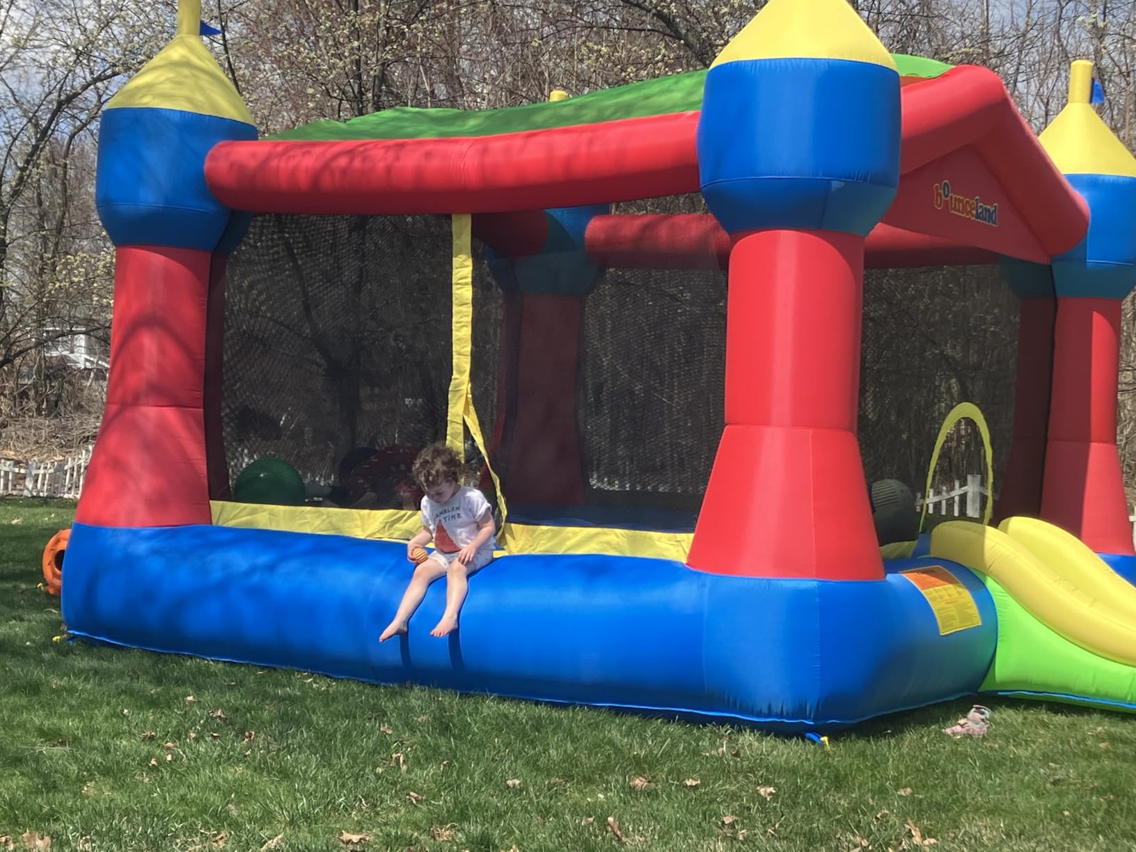 Bounceland Inflatable Party Castle Bounce House Bouncer, 16 ft L x 13 ft W x 10.3 ft H, Basketball Hoop, Removable Sun Roof, UL Strong Blower included, Fun Slide and Bounce Area, Castle Theme for Kids customer photo 2
