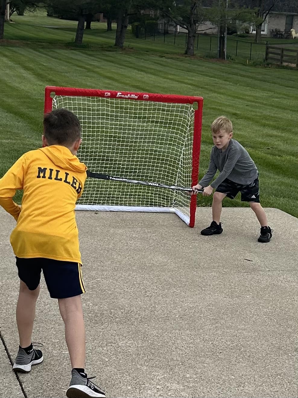 Franklin Sports Hockey Goal, Ball, and Stick Set - NHL | Driveway Fun for Beginners, Complete Starter Kit, Lightweight PVC Frame, Durable Pre-Fit Netting, For Junior Players customer photo 2