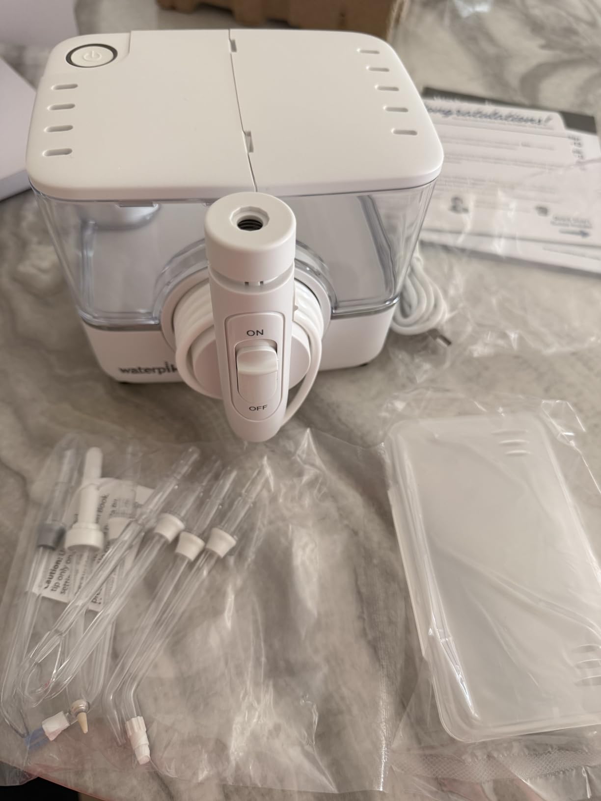 Waterpik ION Rechargeable Water Flosser with 10 Settings, 7 Tips, White customer photo 1